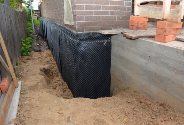 SJ Waterproofing Pros technician performing targeted Sump Pump Installation assessment in Southfield, MI